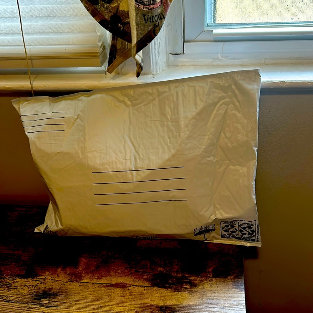 Mystery envelope with a couple of things in there could accessory clothes